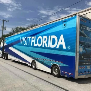 Blue Semi Trailer with Visit Florida written on the side and back