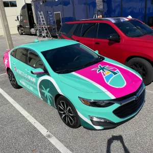 Aqua Blue and Pink commercial wrap on car